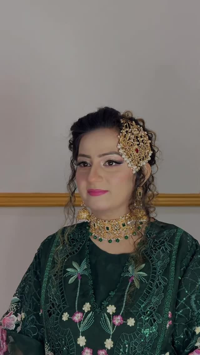 Green occasion look with curled updo